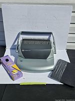 GBC CombBind C110 binder with Staples spines box and black covers