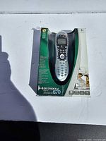 Front view of Logitech Harmony 670 remote in retail packaging