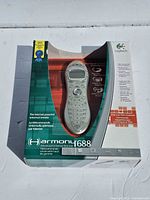 Front of retail box showing Logitech Harmony 688 remote