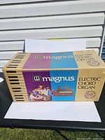 Front of retail box showing Magnus Electric Chord Organ branding and graphics
