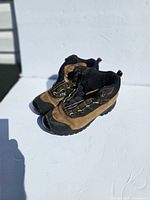 Side view of both boots showing uppers and lacing