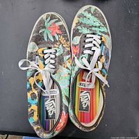 Top view of both shoes showing floral canvas uppers and rainbow footbeds