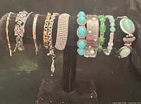 Full view of all twelve bracelets on display stand