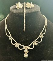 Full set displayed on form: necklace, bracelet, earrings