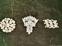 All three brooches front view