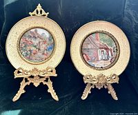 Front view showing both brass plaques on stands