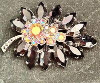 Front view of brooch showing full design and stone arrangement