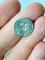 Obverse of 1638 Stralsund silver coin between fingers