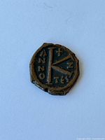 Obverse view of the Byzantine bronze coin showing design and patina