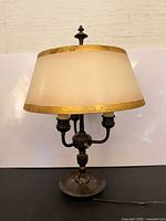 Front view of lamp with shade attached, showing overall form