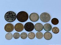 All seventeen coins arranged obverse side up