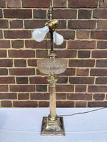 Full view of lamp showing base, column, glass font, dual sockets and cord