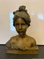 Front view of bronze bust sculpture