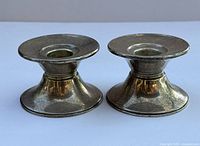 Top view of both candlesticks showing openings for candle insertion