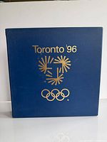 front of blue cloth slipcase showing logo