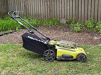 Full side view showing mower, bag, handle and overall condition