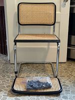 Full front view of Cesca chair with extra backrest and bag of glides