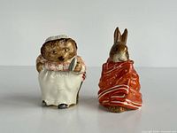 Front view of both figurines