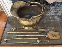 Bucket and tools laid on hearth showing overall lot