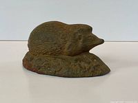 Front view of cast iron hedgehog doorstop