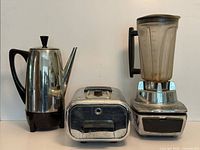 Group shot of percolator, toaster oven and blender