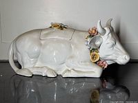 Side view of bull-shaped tureen showing overall form and lid