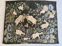 Full view of tapestry showing complete animal and floral scene