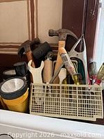 Assorted hand tools in plastic organizer