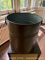 Side view showing copper exterior and handle