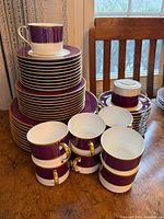 Stacked plates and cups showing quantity and pattern