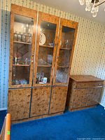 Three-door glass china cabinet and matching veneer