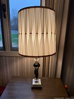 Full view of lamp with shade illuminated