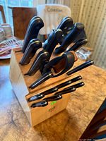 Angled view of Philippe Richard knife block with knives and steak knives visible
