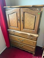 Front view of closed dresser showing doors and drawers