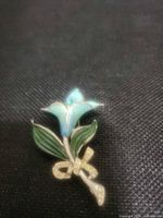 front view showing enamel colours and rhinestone bow