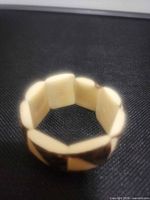 Overall view of tagua stretch bracelet standing upright