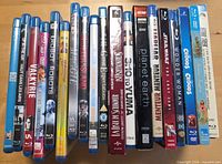 Front view of 18 Blu-ray cases standing upright showing titles on spines