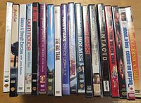 Row of 18 DVD spines showing titles and cases