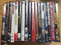 Front view of 17 DVD cases showing spines and titles