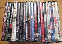 Front view of nineteen DVD cases showing assorted titles