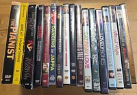 Front spines of approximately 15 DVD cases showing visible titles