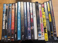 Row of 18 DVD cases showing all titles