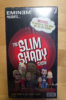 Front view of sealed VHS showing cover art, shrink wrap, and bonus content sticker