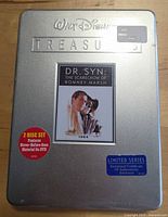 Front view of sealed Walt Disney Treasures Dr. Syn tin showing artwork, stickers, and intact seal