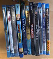 Front view of 11 factory-sealed Blu-ray spines showing titles and shrink-wrap condition