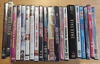 Row of 22 shrink-wrapped DVD cases showing spines and titles