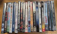 Row of 22 sealed DVD cases showing spines
