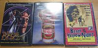 Front view of all three sealed horror DVDs