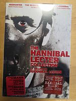 Front view of sealed Hannibal Lecter Collection DVD box set showing titles and stickers