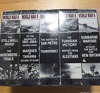 Front spines of ten World War II documentary VHS tapes in slipcases
